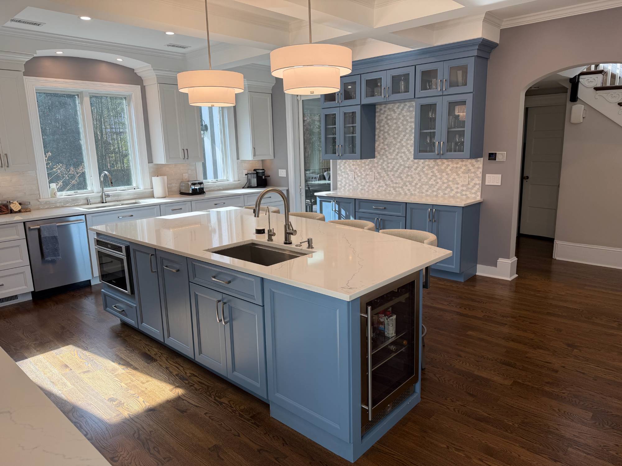 Spacious custom kitchen remodel with a blue island and built-in hutch by Managed Renovations in Chevy Chase, MD.-optimized