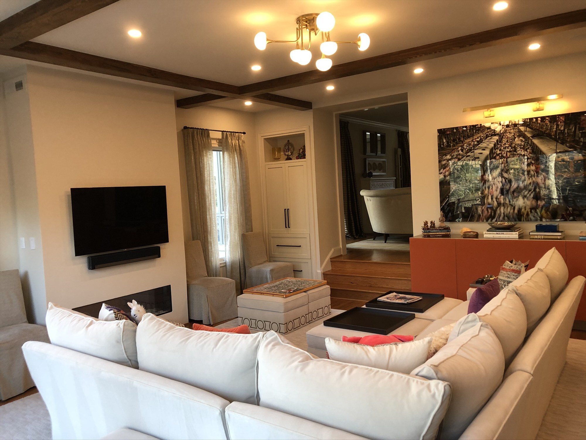 white built in niche cabinet with staircase and dining room view living room renovation 14 - optimized