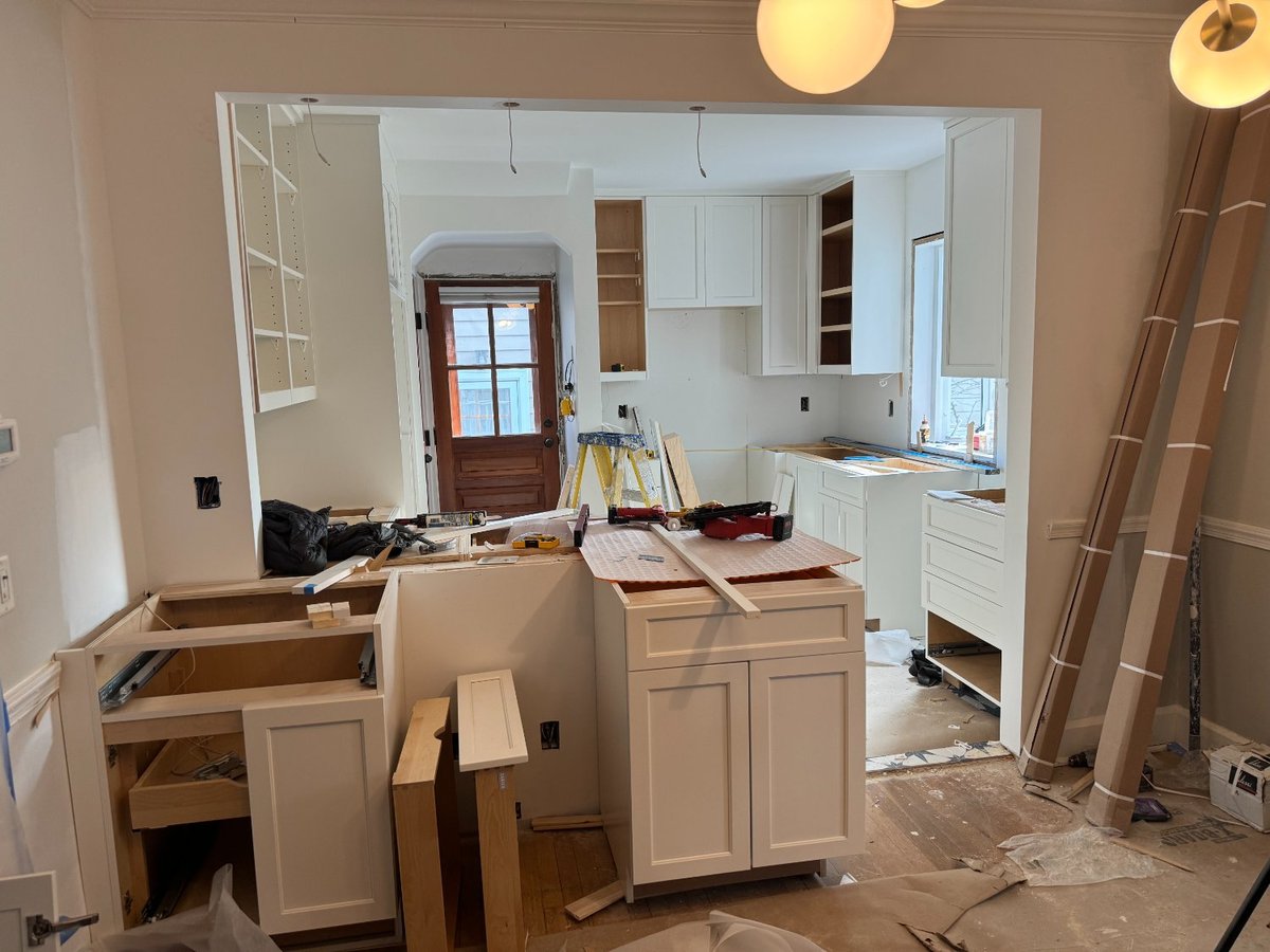 Cabinet installation progressing for the kitchen remodel in Chevy Chase, MD.
