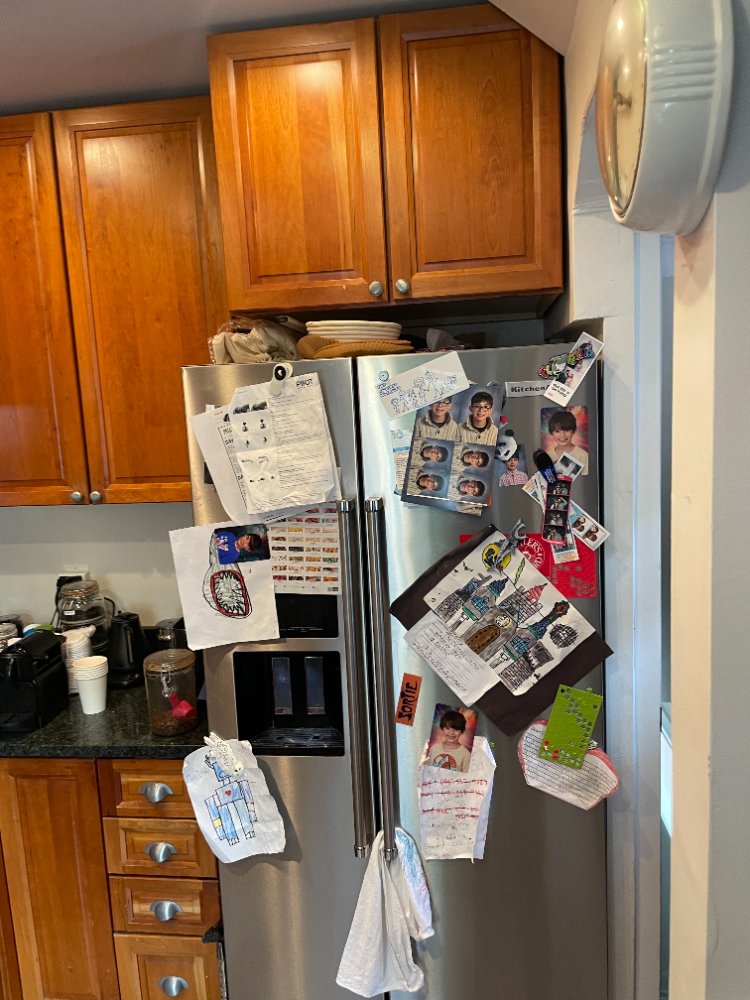 Existing refrigerator wall before the kitchen remodel in Chevy Chase, MD.