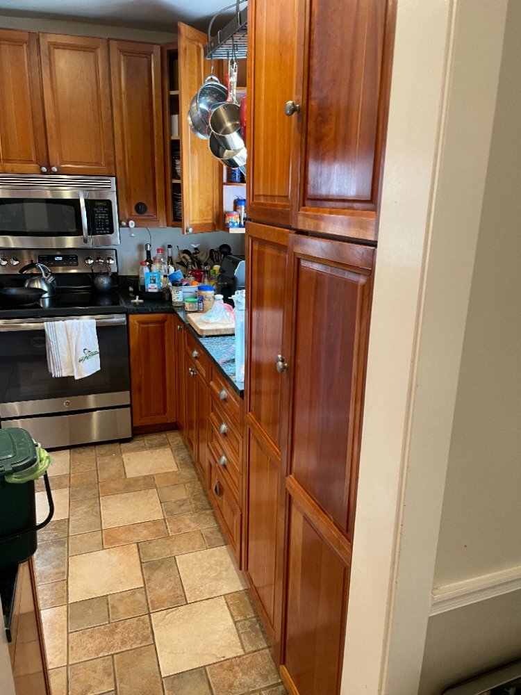 Original kitchen layout before the kitchen remodel in Chevy Chase, MD, featuring stained wood cabinets.