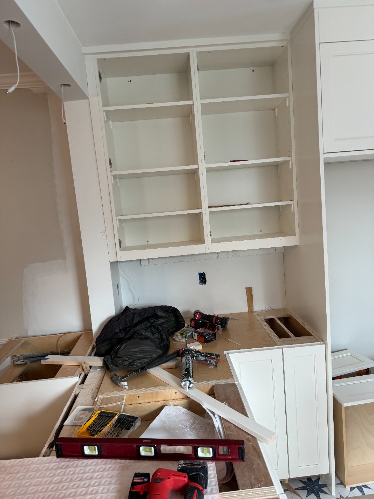 Upper white shaker cabinets installed for the kitchen remodel in Chevy Chase, MD.