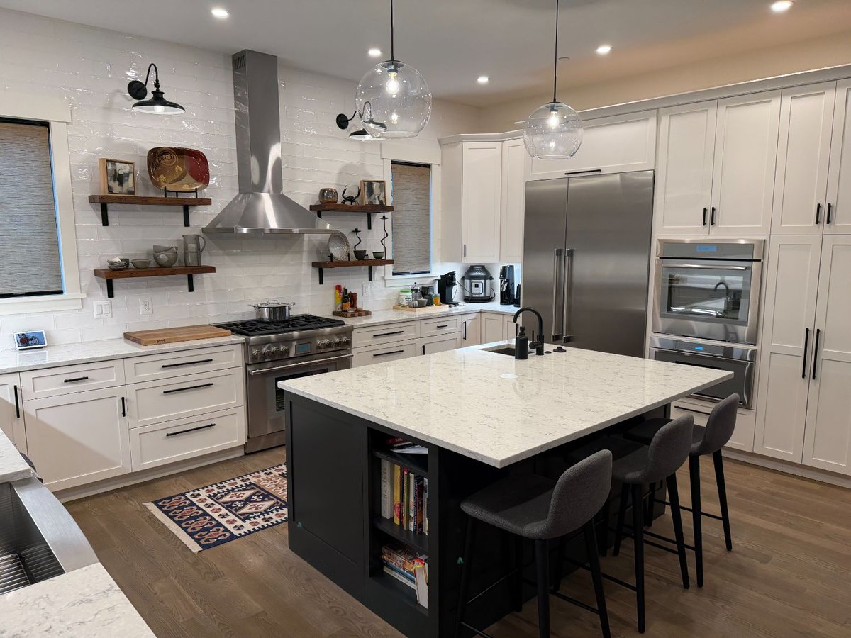 Corner view of new house custom kitche in Chevy Chase, MD featuring a large island, farmhouse