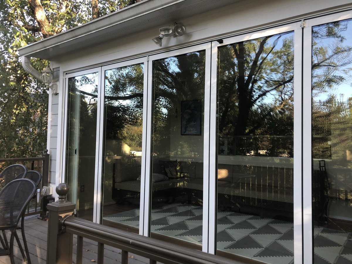 floor to ceiling glass doors on sunroom and deck addition in chevy chase md