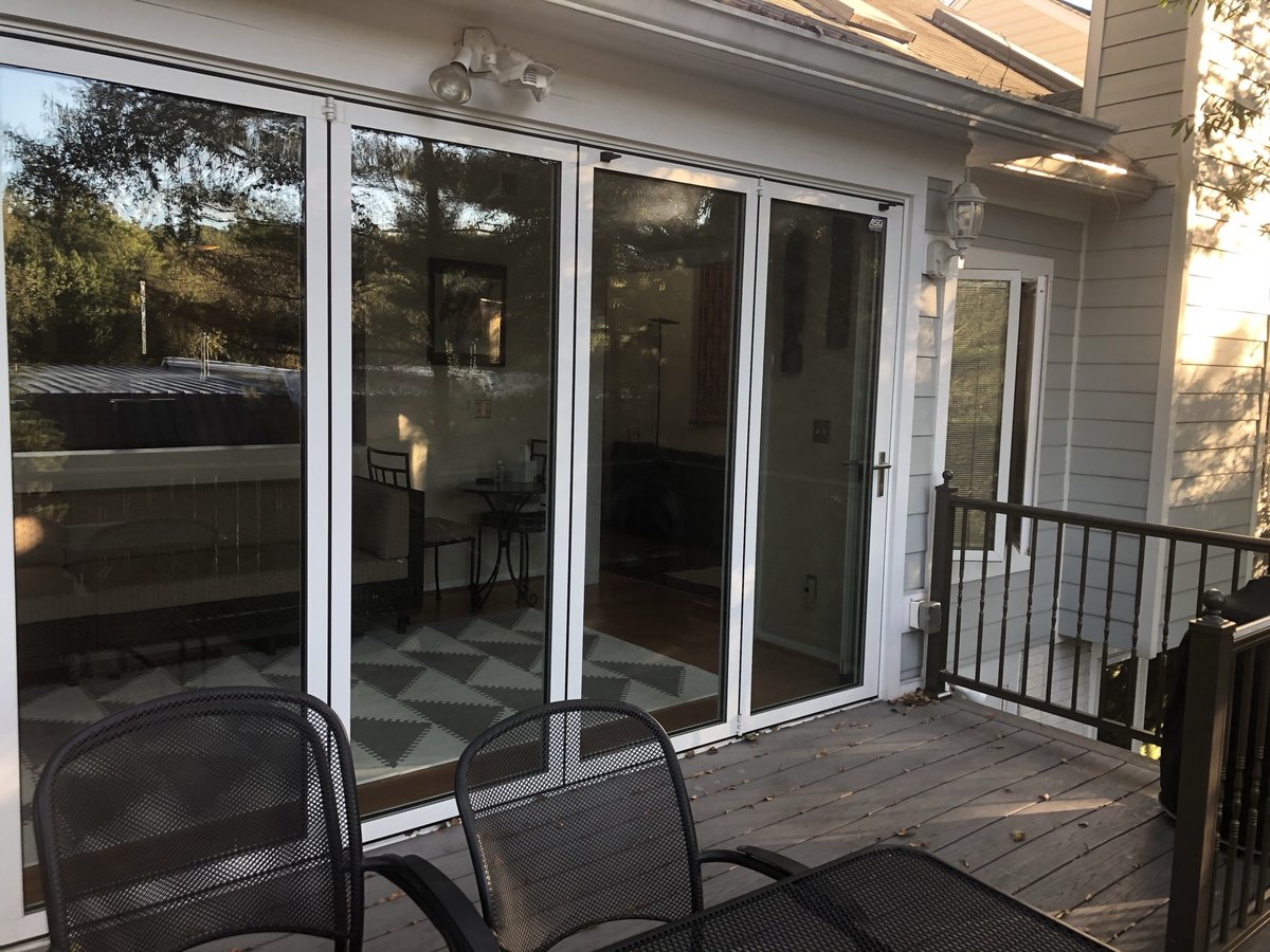 glass doors opening to sunroom and deck addition in chevy chase md