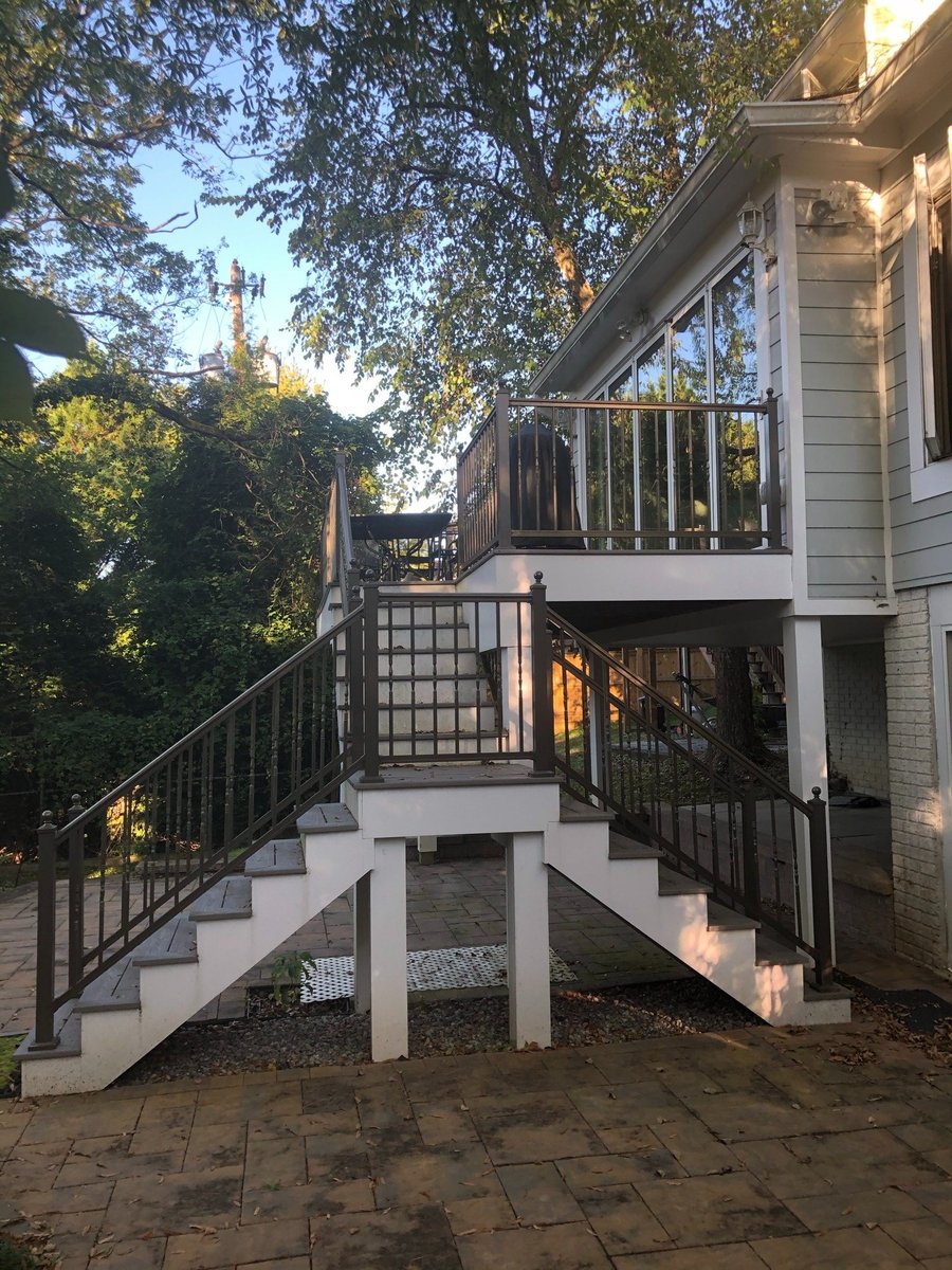 split staircase leading to elevated deck in chevy chase md sunroom and deck addition