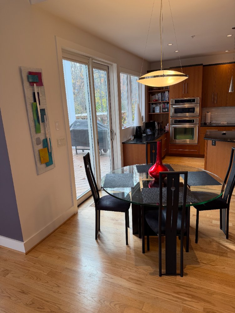 Contemporary dining area beside the custom kitchen in the new house in Chevy Chase, MD.