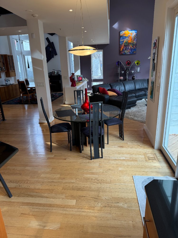 Open-concept dining and living area connected to the custom kitchen in Chevy Chase, MD.