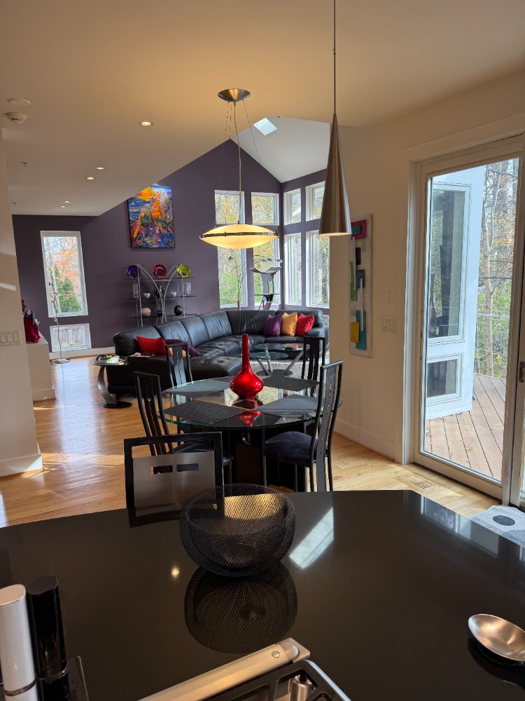 View across the kitchen island toward the dining and living areas in Chevy Chase, MD.