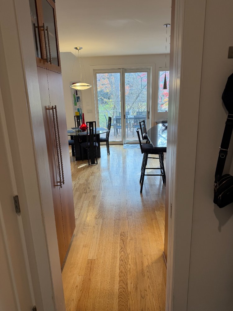 View from the hallway into the custom kitchen and dining area in Chevy Chase, MD.