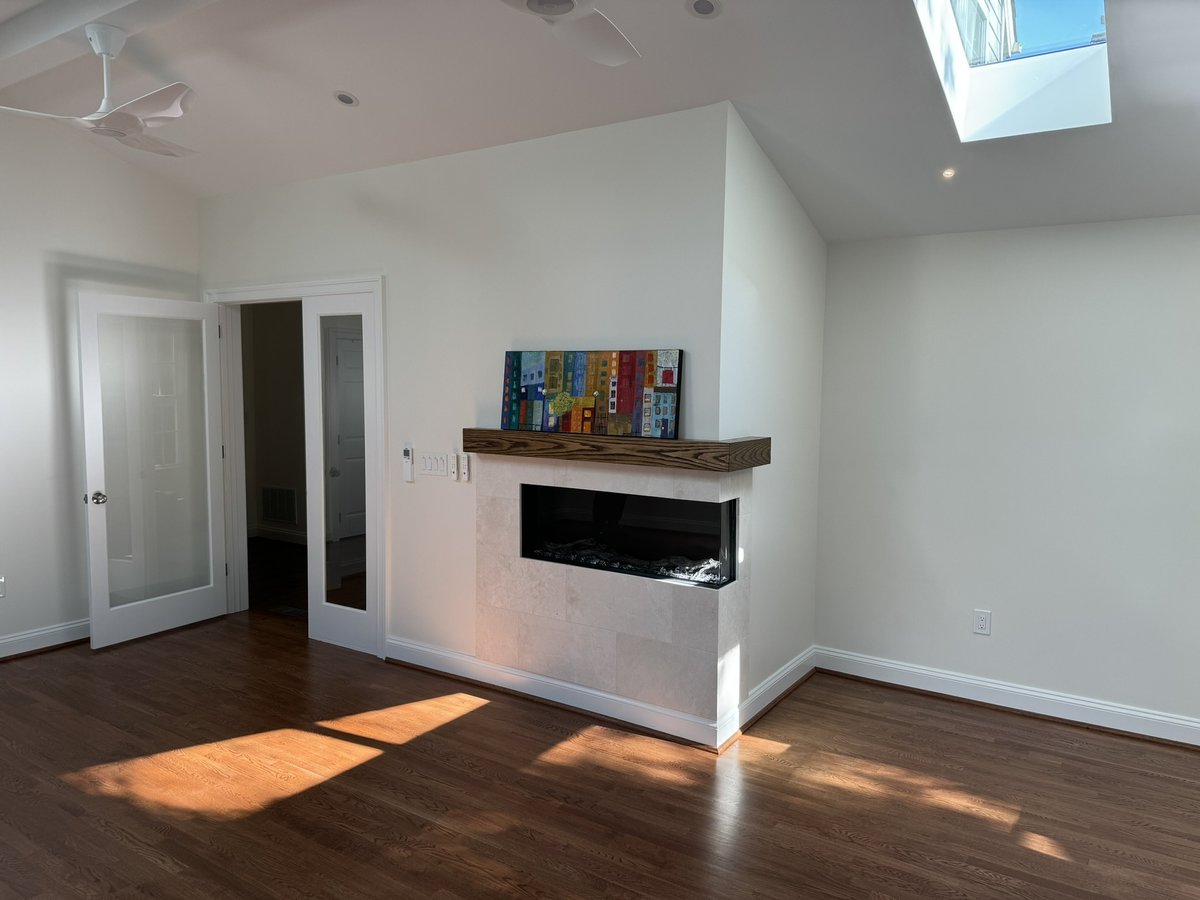 chevy chase md addition featuring modern fireplace vaulted ceiling and hardwood floors