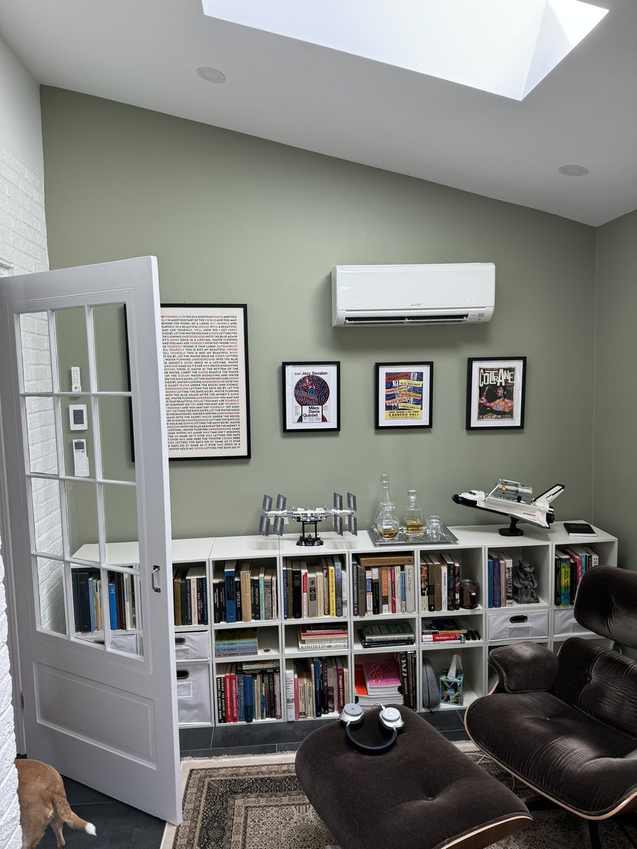 chevy chase md addition home office with bookcases lounge chair and framed music art