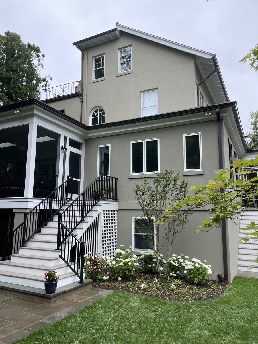 addition and exterior hardscaping showing rear home addition white stairs and landscaped garden in chevy chase md