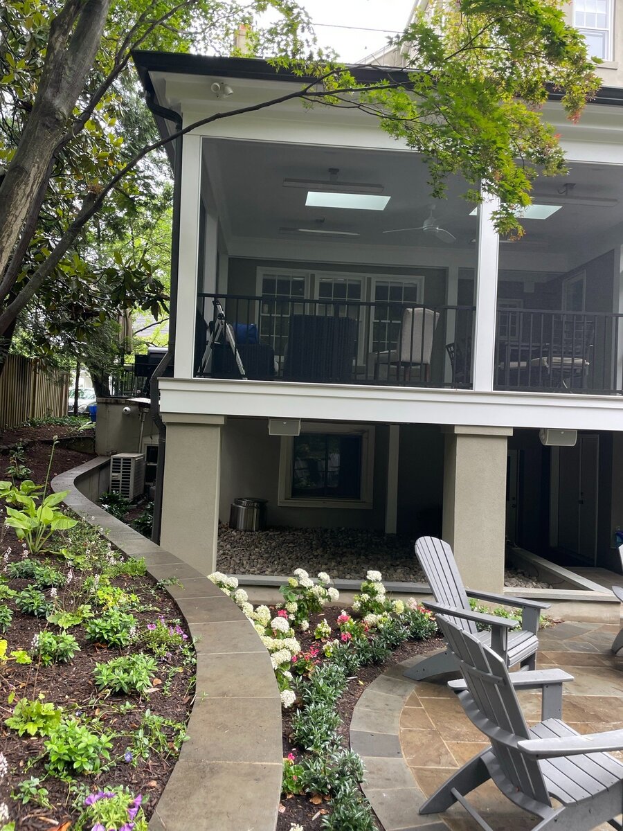 addition and exterior hardscaping with screened porch stairs and stone patio in chevy chase md