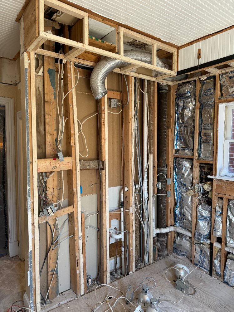 Exposed kitchen framing and utilities during remodeling in Northwest Washington, D.C.