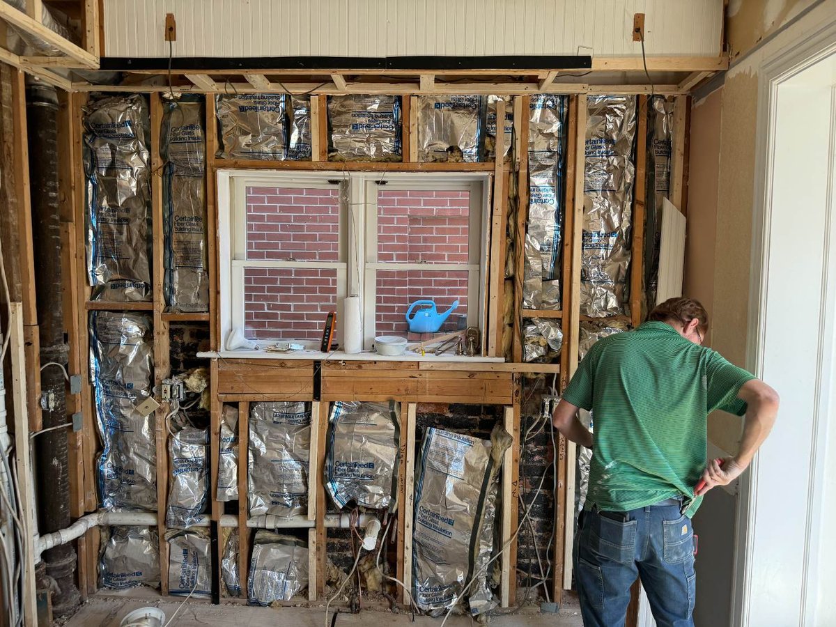 Kitchen demolition exposing framing and plumbing during remodeling in Northwest Washington, D.C.
