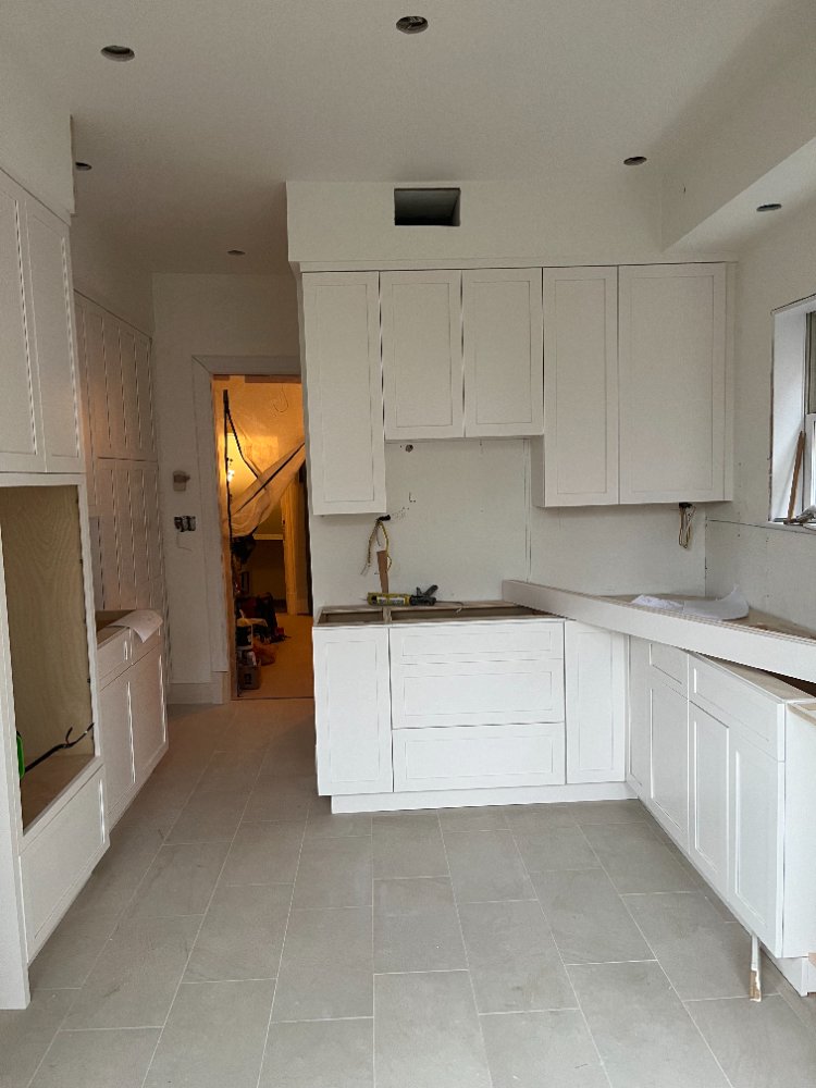 New white shaker kitchen cabinets being installed in Northwest Washington, D.C.