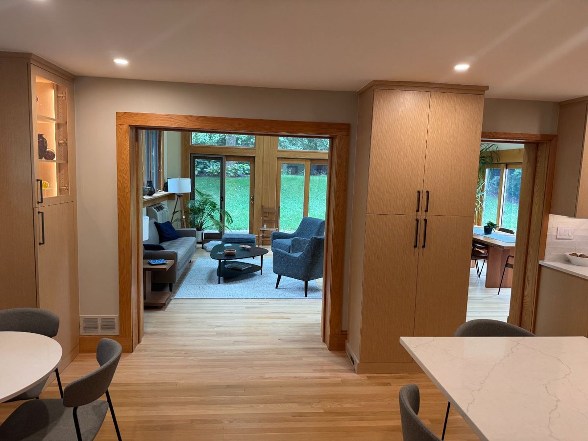 After view of the remodeled kitchen opening into the adjacent living area in Kensington, MD.