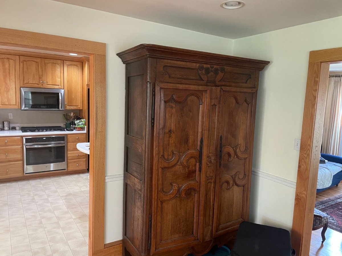 Before view of the original kitchen and adjacent hallway before remodeling in Kensington, MD.