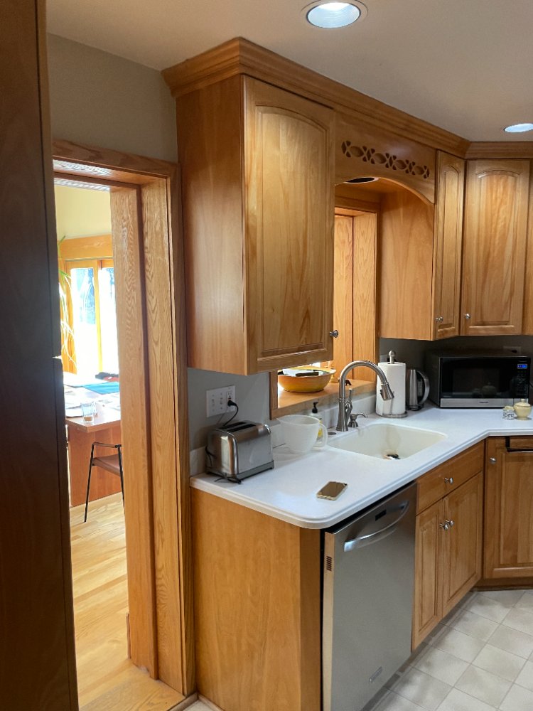 Before view of the original kitchen sink and countertop before a kitchen remodel in Kensington, MD.