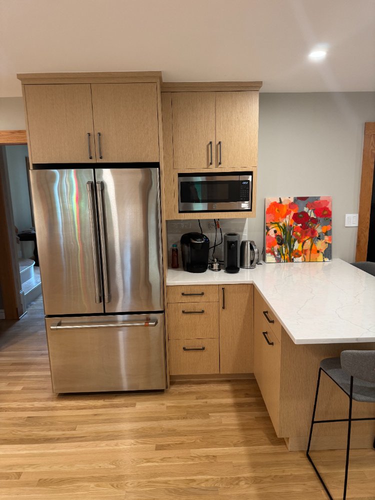 Custom refrigerator surround and coffee station in a Kensington, MD kitchen remodel.
