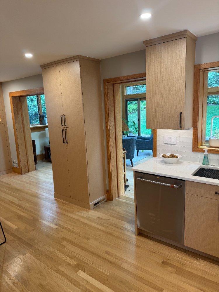 Floor-to-ceiling pantry cabinets and quartz countertops installed during a kitchen remodel in Kensington, MD.