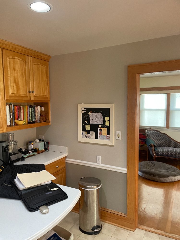 Pre-remodel kitchen showing the original peninsula and room transition in Kensington, MD.