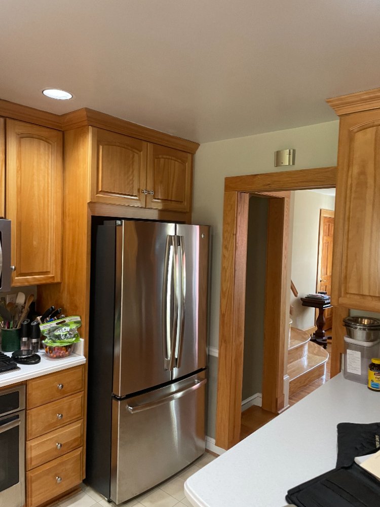 Pre-remodel kitchen showing the original refrigerator placement in a Kensington, MD home.
