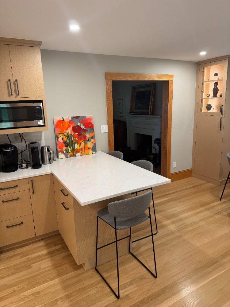 Spacious quartz peninsula with seating in a Kensington, MD kitchen remodel.