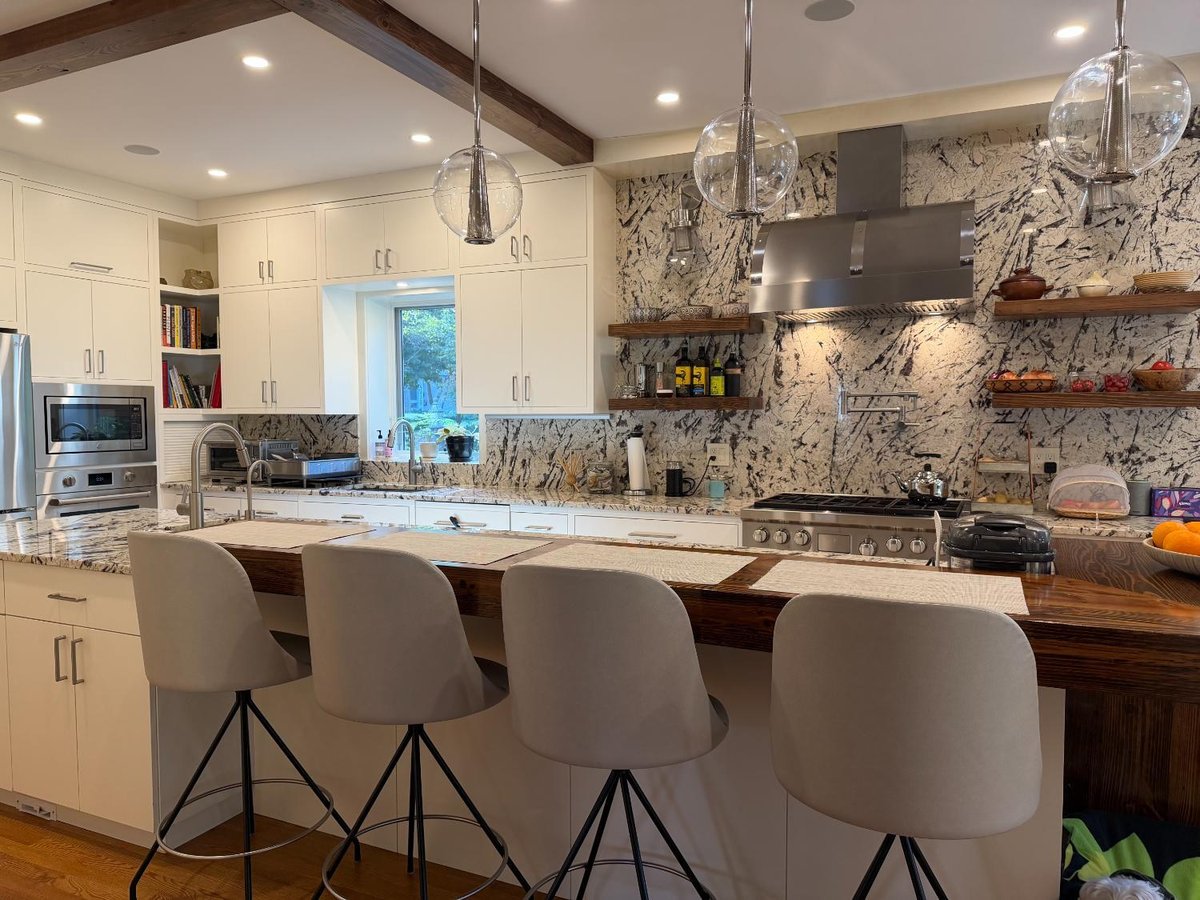 Breakfast bar seating and custom kitchen cabinetry in a Northwest Washington, D.C. remodel.
