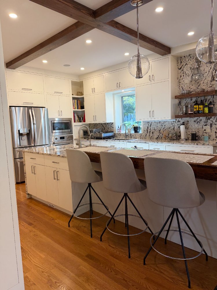 Contemporary kitchen remodel in Northwest Washington, D.C. with custom breakfast bar seating.