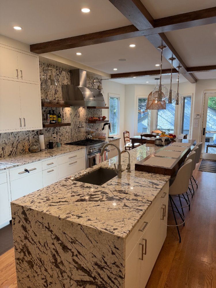 Luxury Northwest Washington, D.C. kitchen renovation featuring custom cabinets and bold stone surfaces.