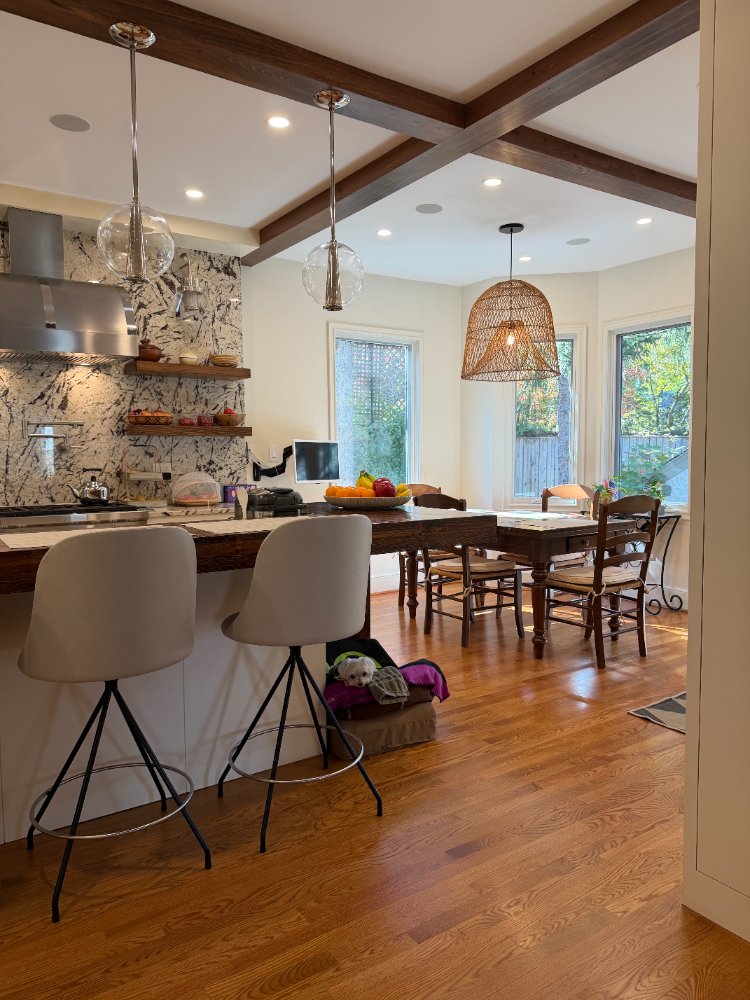 Open kitchen and dining space remodeled in Northwest Washington, D.C. with premium finishes.