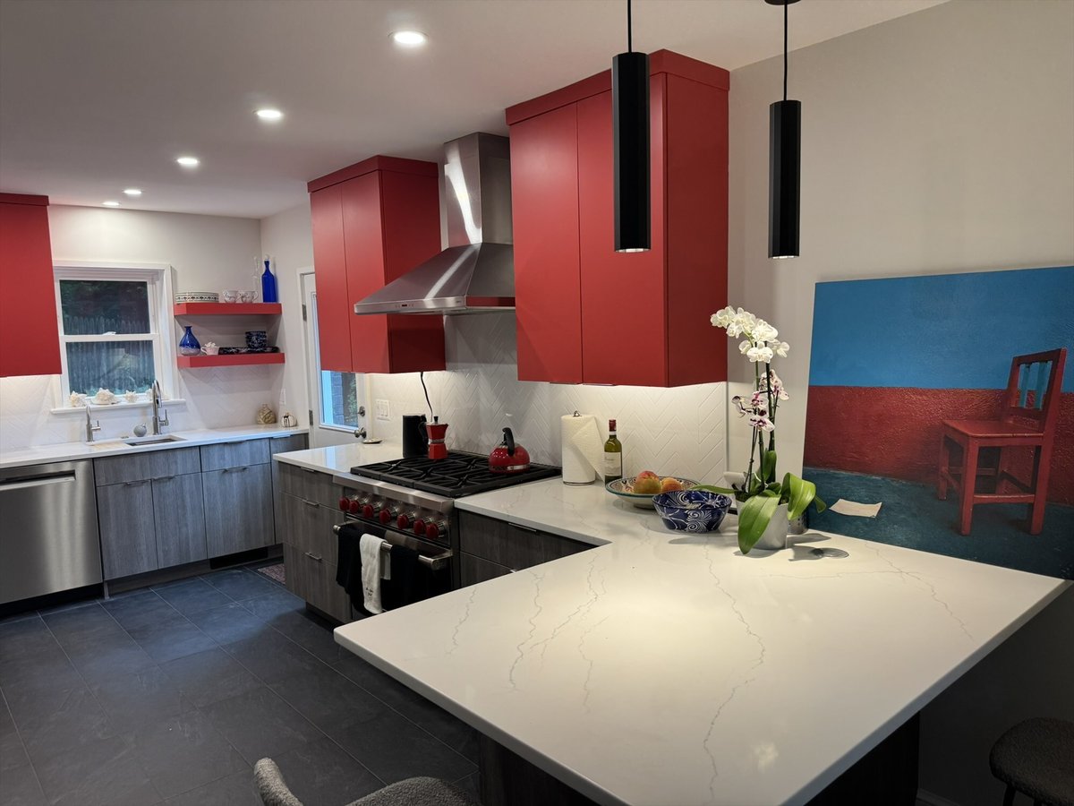 Contemporary kitchen remodel with red cabinetry, white herringbone backsplash, and a quartz peninsula in Chevy Chase, MD - optim
