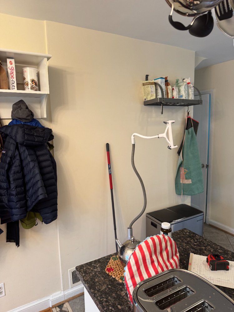 Original wall storage and utility area in the kitchen before renovation in Chevy Chase, MD.