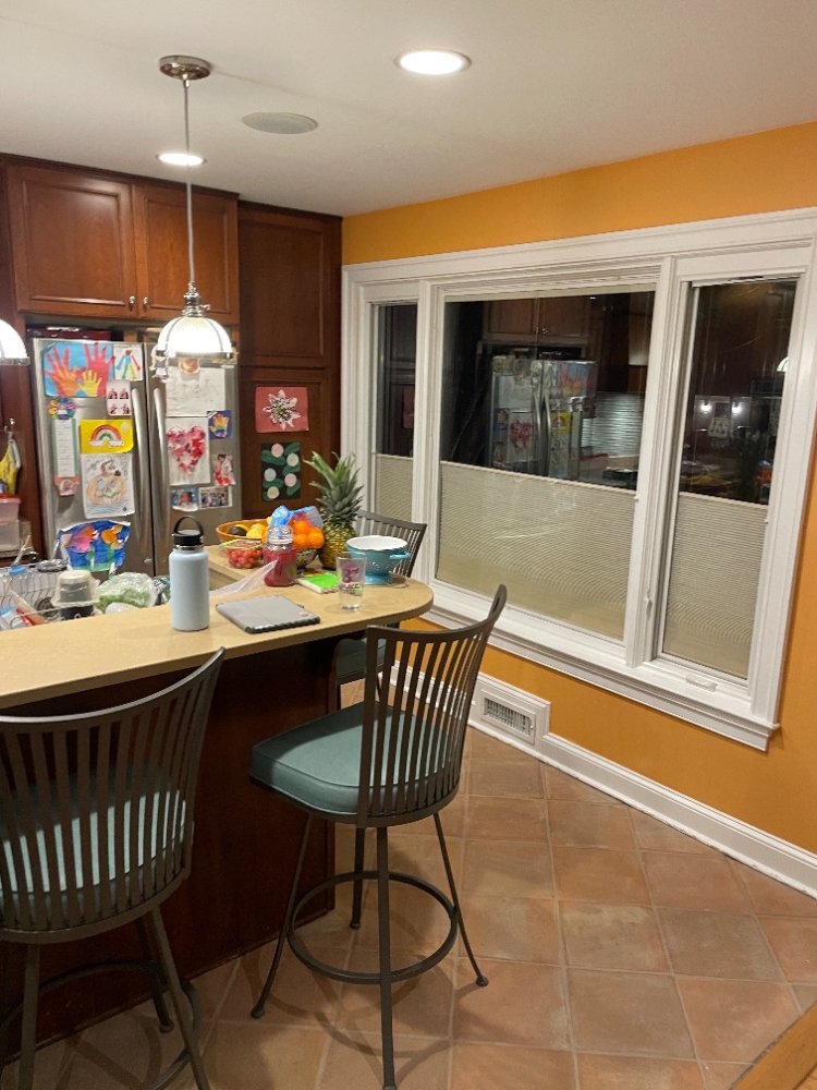 Before view of a kitchen dining area awaiting remodeling in Bethesda, MD.