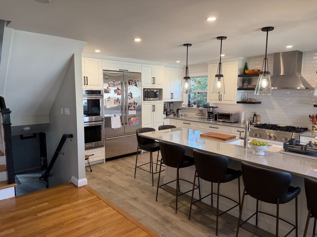 Bethesda, MD kitchen remodel featuring custom white cabinetry, quartz countertops, and a spacious layout.