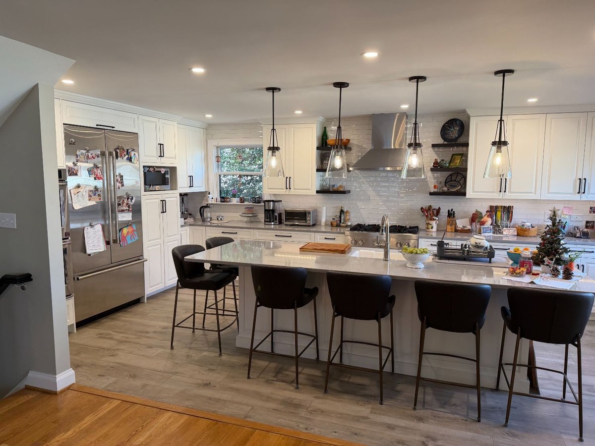 Bright kitchen renovation showcasing quartz countertops and custom cabinetry in Bethesda, MD.