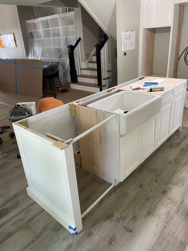 Kitchen island cabinet installation underway during a Bethesda, MD renovation.
