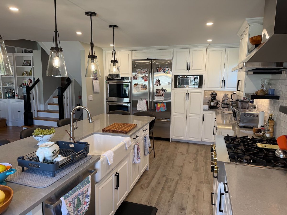 Open-concept kitchen remodel in Bethesda, MD featuring a spacious quartz island and custom cabinetry.