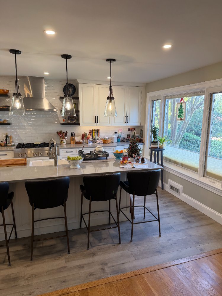 Spacious kitchen remodel highlighting white shaker cabinets and a bright open layout in Bethesda, MD.