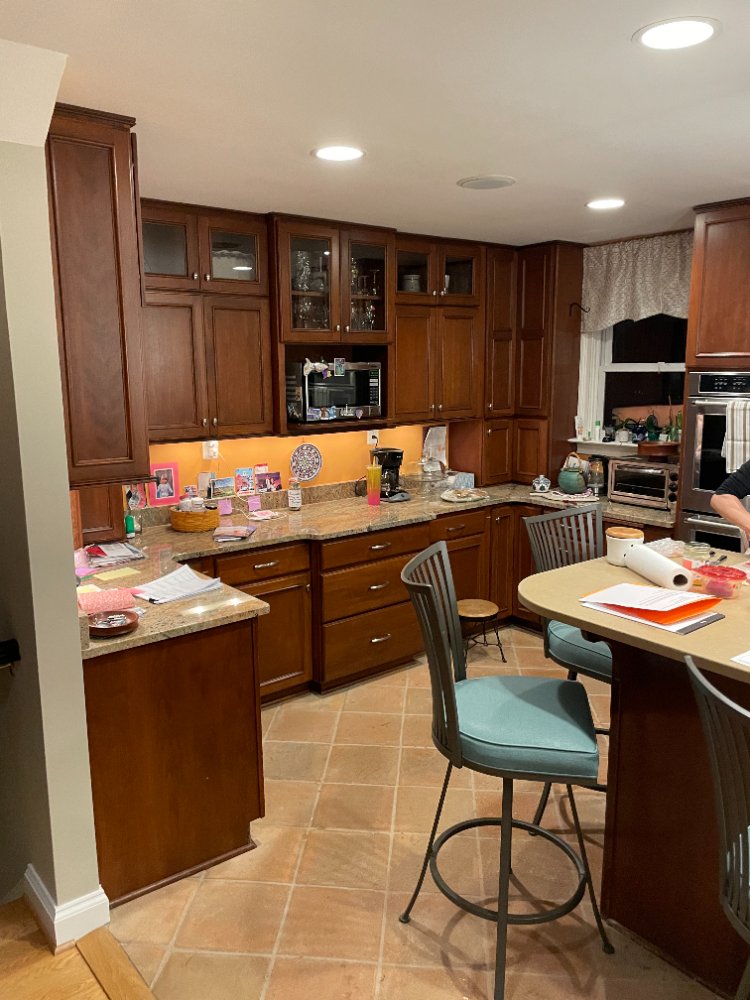 Traditional kitchen with dark wood cabinets prior to remodeling in Bethesda, MD.