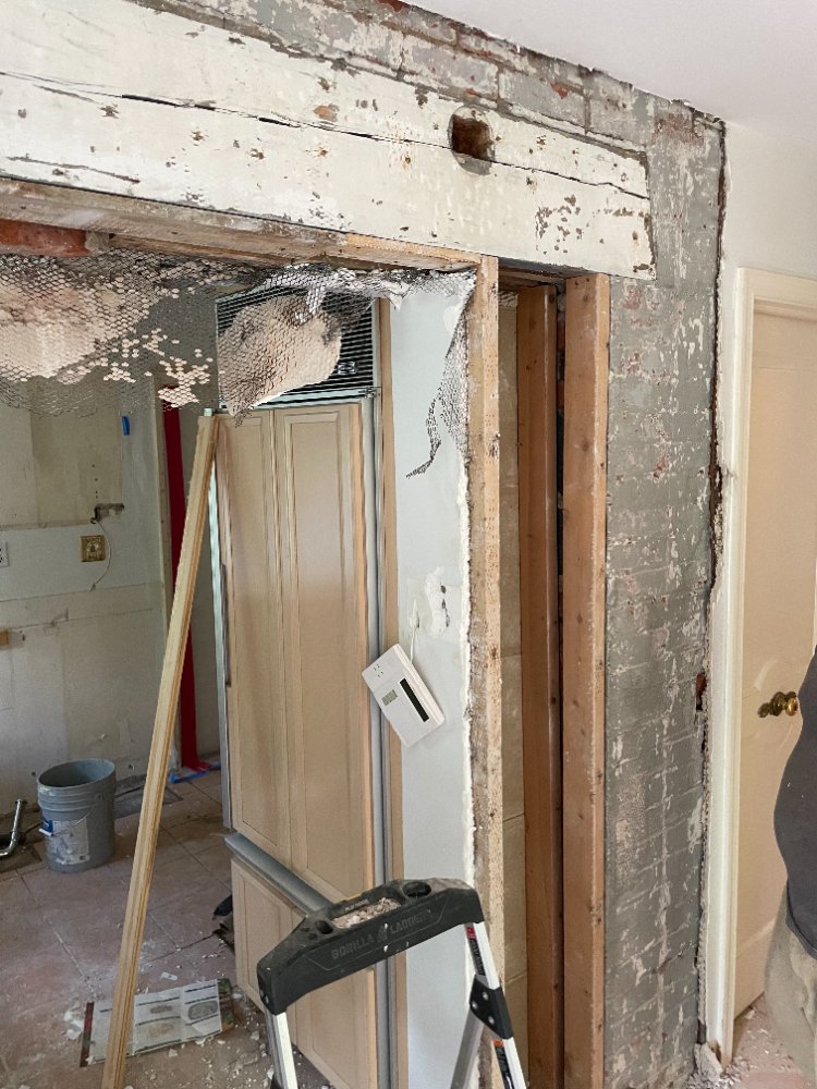 Demolition reveals original framing and masonry during the Chevy Chase, MD kitchen renovation.