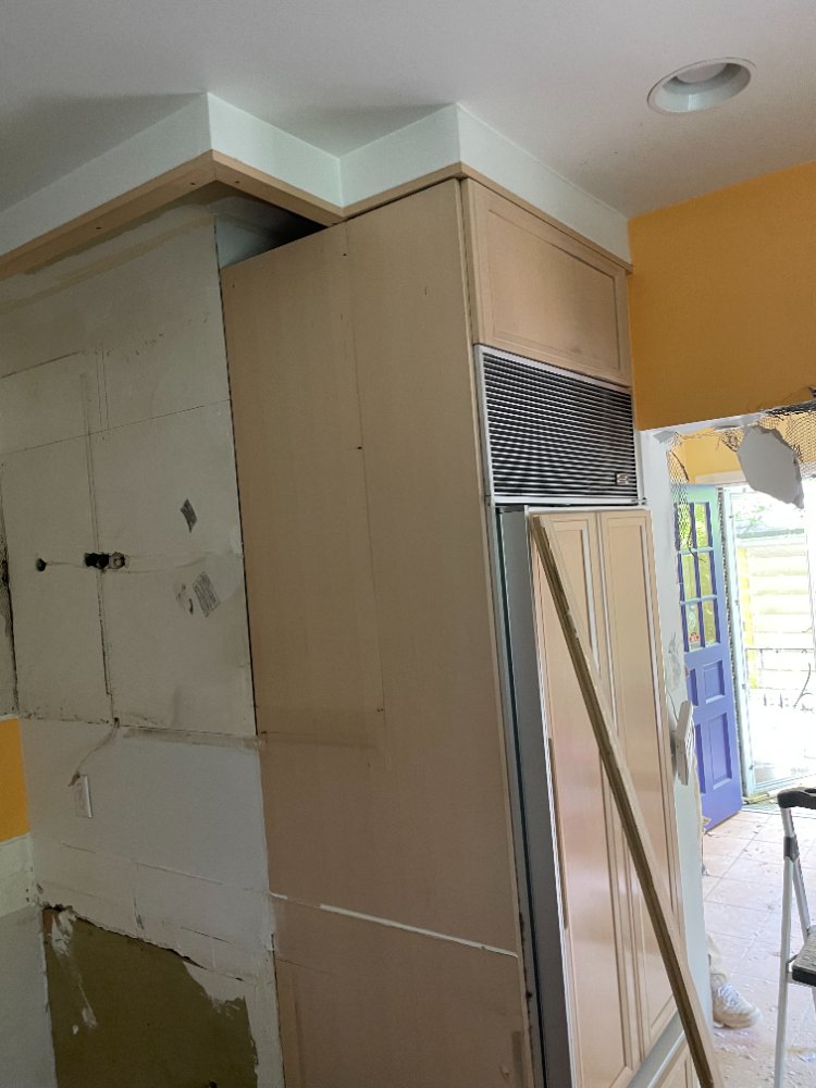 Kitchen renovation progress in Chevy Chase, MD showing wall preparation and existing cabinetry during remodeling.