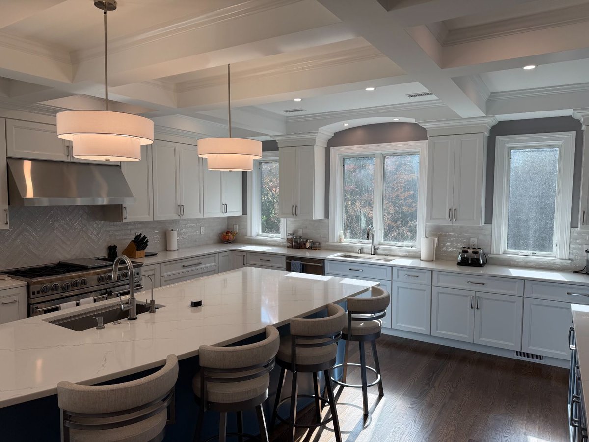Elegant remodeled kitchen in Chevy Chase, MD showcasing custom cabinetry and quartz surfaces.
