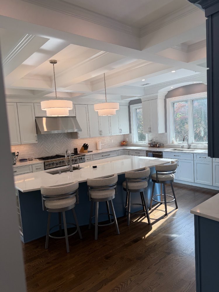 Luxury kitchen renovation in Chevy Chase, MD with custom cabinetry, quartz countertops, and oversized windows.