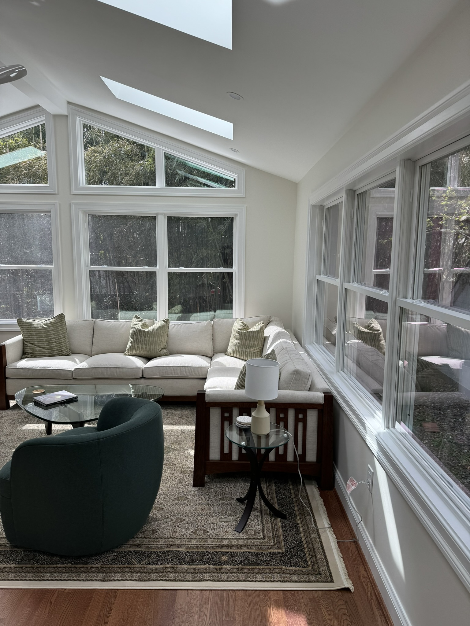 chevy chase md addition living room with sectional sofa large windows skylights and side table
