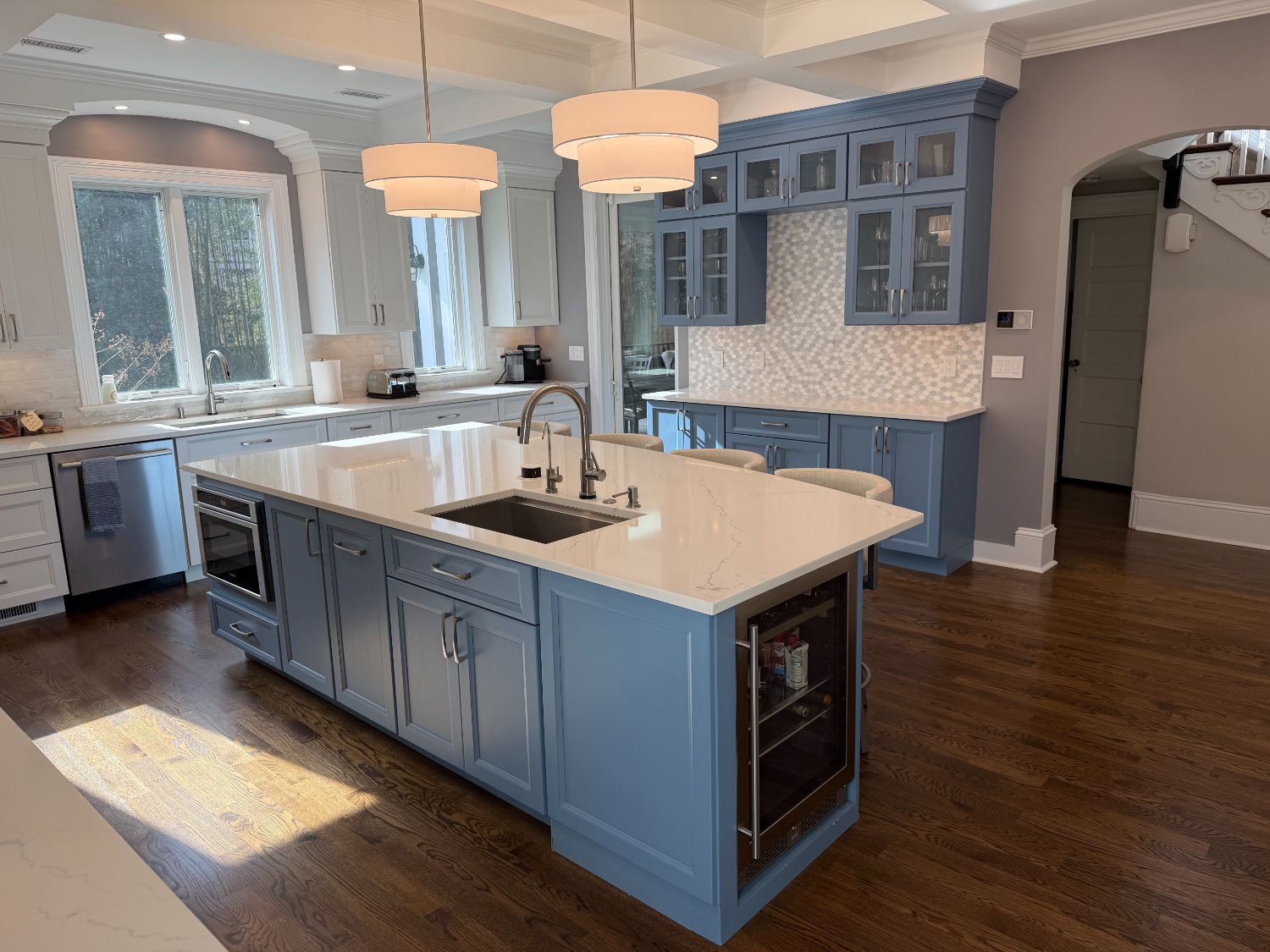 Spacious custom kitchen remodel with a blue island and built-in hutch by Managed Renovations in Chevy Chase, MD.-optimized